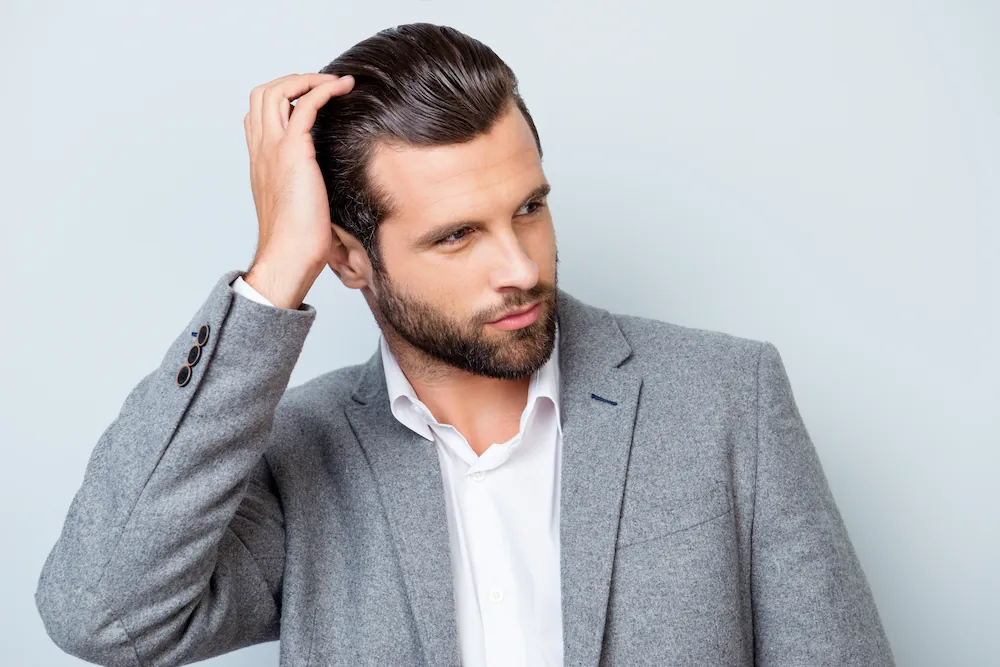 Confident man with thick hair