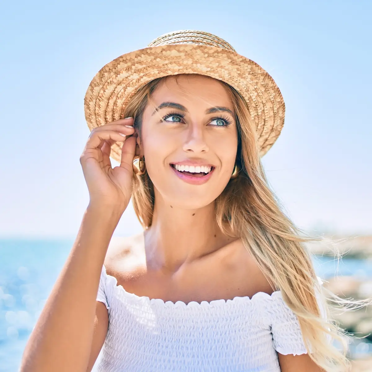 Smiling woman in a straw hat