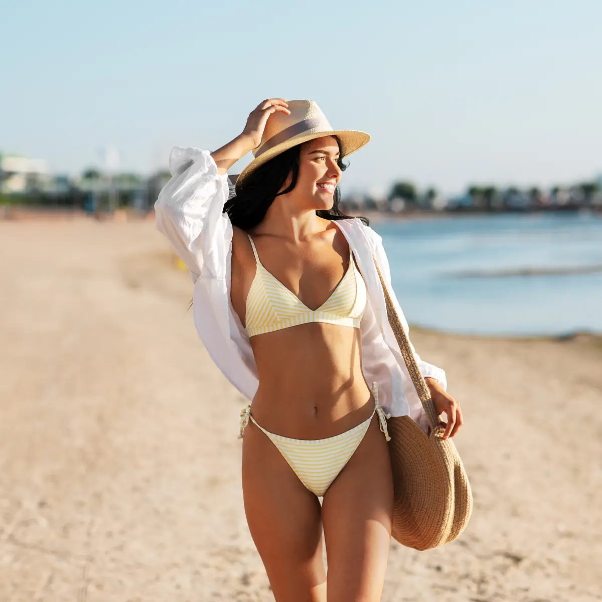 Woman in a bikini walking on the beach